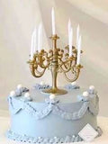 Modern gold candle holder with candles